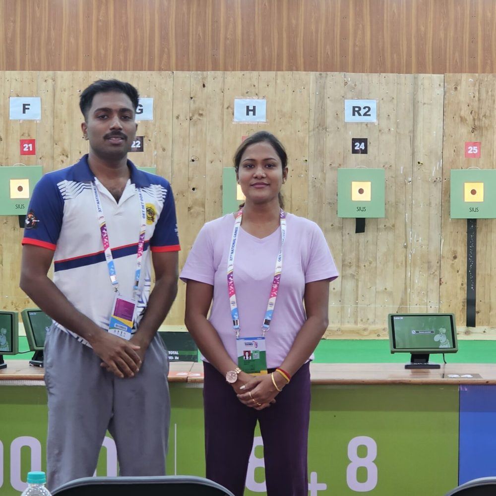 Coach Naveen P. R. instructing students during shooting practice